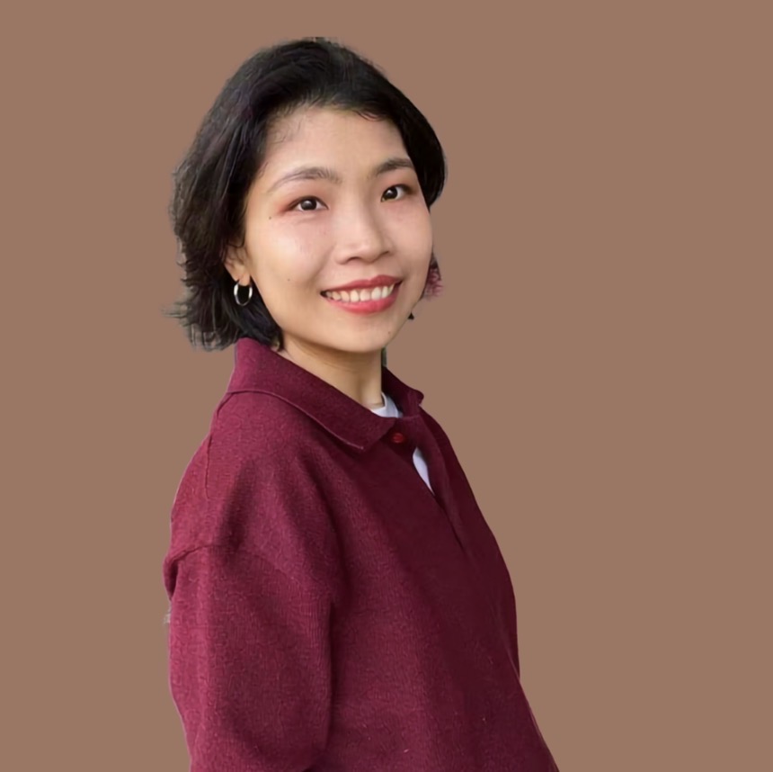 Xiaoen Cao, smiling, in a burgundy collared sweater